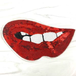 Red lips sequin sew on patch.  Attached to a poly fiber back. 121/2” x 7”